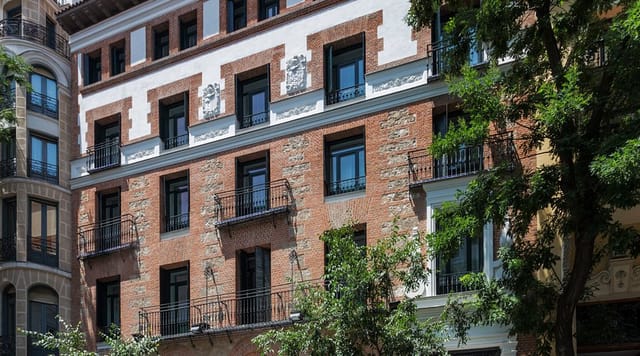 Boutique hotel exterior at One Shot Fortuny, historic architecture for corporate retreats.