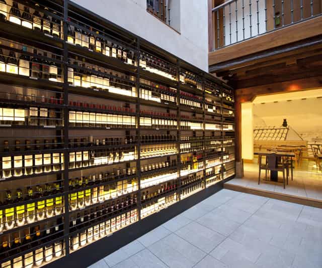 Feature wall in Posada del León de Oro restaurant for wine tastings and corporate networking events.