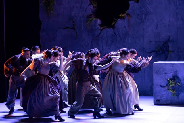 Stage performance at Centro Danza Matadero with dramatic lighting, dance event, cultural show.