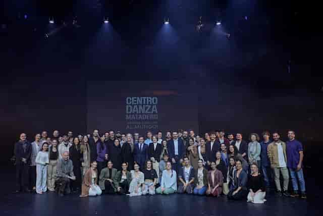 Group photo at Centro Danza Matadero, professional event lighting and stage backdrop.