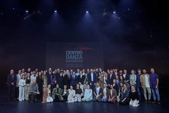 Group photo at Centro Danza Matadero, professional event lighting and stage backdrop.