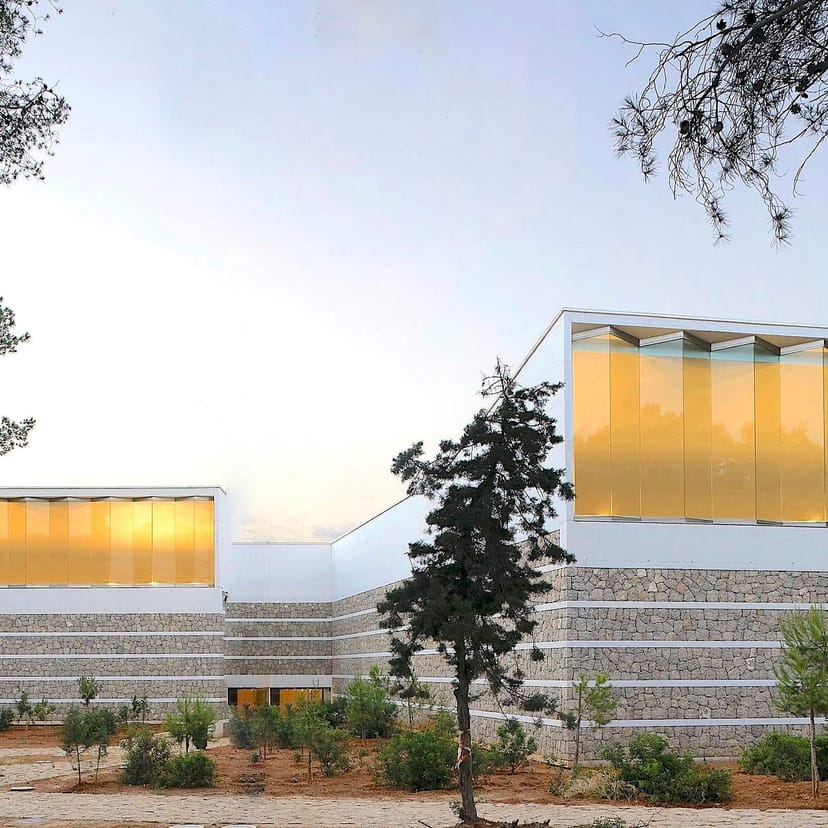 Modern Ibiza Congress Center auditorium with amber glass design for corporate events and galas.