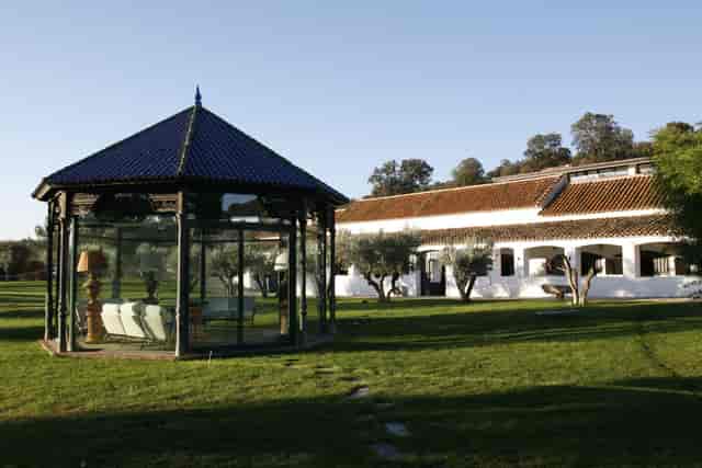 Glass pavilion event space at La Finca El Bosque for corporate meetings and VIP conferences.