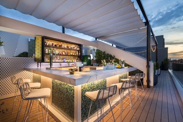 Prince, Bowie, Jackson rooftop lounge: sophisticated bar for evening cocktail networking events.