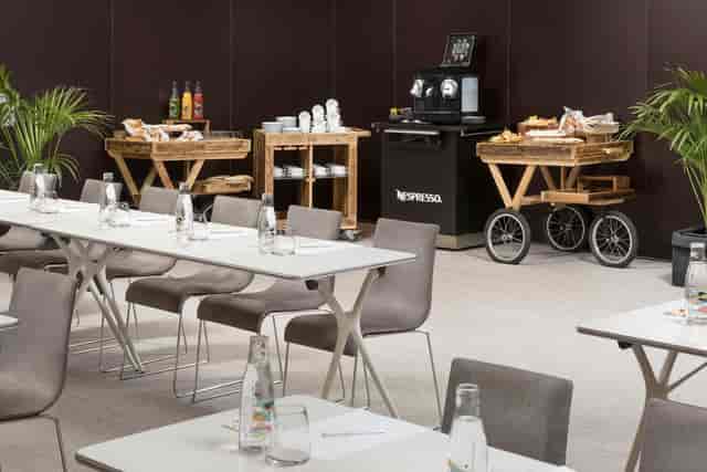 Radio Rooftop Madrid breakout room with conference setup and coffee service for corporate meetings.