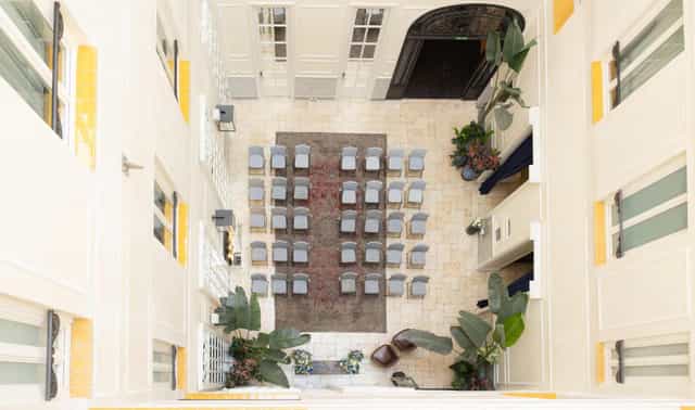 Bodas Urbanas courtyard wedding ceremony at Only YOU Boutique Hotel Madrid with theater seating.
