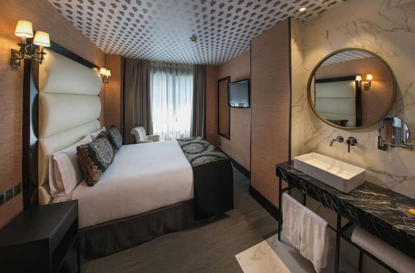 Upscale boutique hotel room with open vanity for urban corporate events and luxury travel venue.