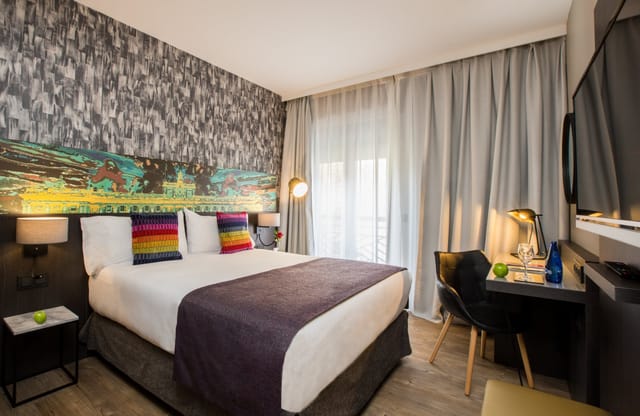 Modern hotel room with ergonomic desk for business travel and boutique event accommodation.