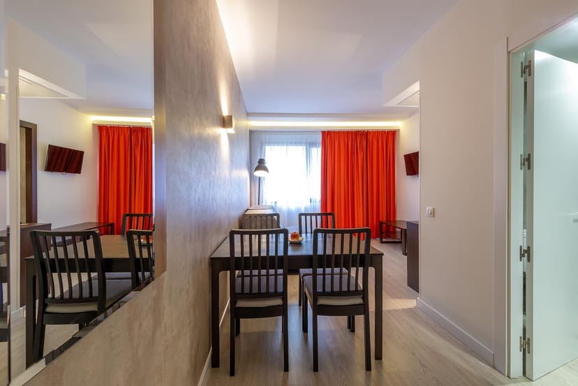 Modern Hotel Serrano dining area with minimalist furniture for VIP meetings and corporate events.