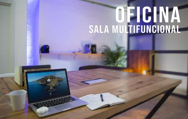 Modern breakout space with rustic wood table for corporate meetings and collaborative workshops.