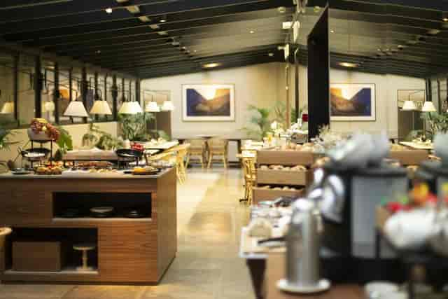 Modern buffet setup at Serrano ICON Embassy for corporate event catering.
