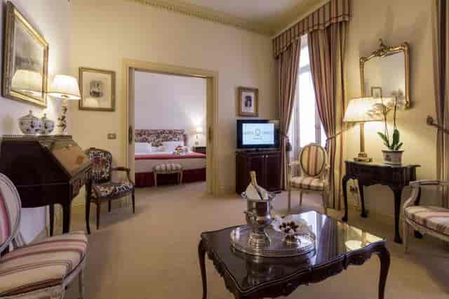 Luxury Salón de Espejos suite in Heritage Madrid Hotel for VIP board meetings and executive travel.