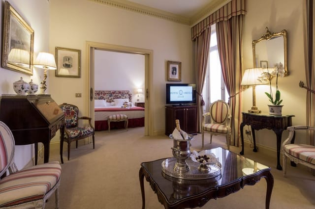 Luxury Salón de Espejos suite in Heritage Madrid Hotel for VIP board meetings and executive travel.