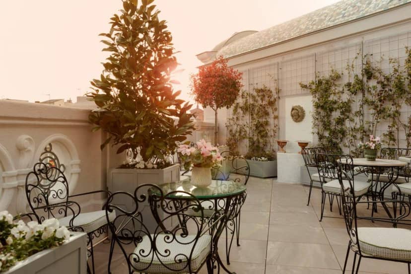 Chic restaurant cocktail reception at Heritage Madrid Hotel with wrought-iron furniture.