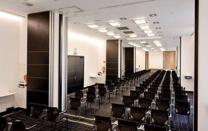 Theater-style ballroom at Hilton Madrid Airport for corporate conferences and professional seminars.