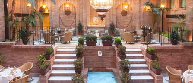 Luxury Alhacaba VIP breakout space with tiered seating for high-end corporate event receptions.