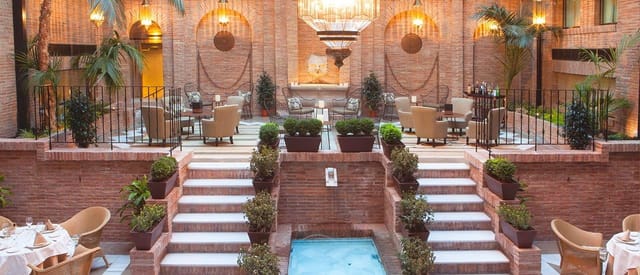 Luxury Alhacaba VIP breakout space with tiered seating for high-end corporate event receptions.