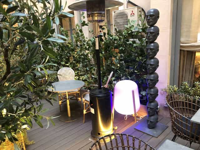 Patio breakout space at Club Monteverdi with HVAC unit for corporate networking and business events.