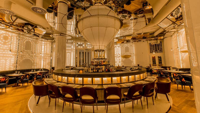 Upscale Grupo Dani García event space with dramatic bar for networking and VIP receptions.