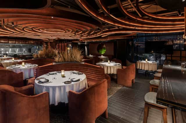 Sophisticated Grupo Dani García booth seating for corporate networking and board dinners.