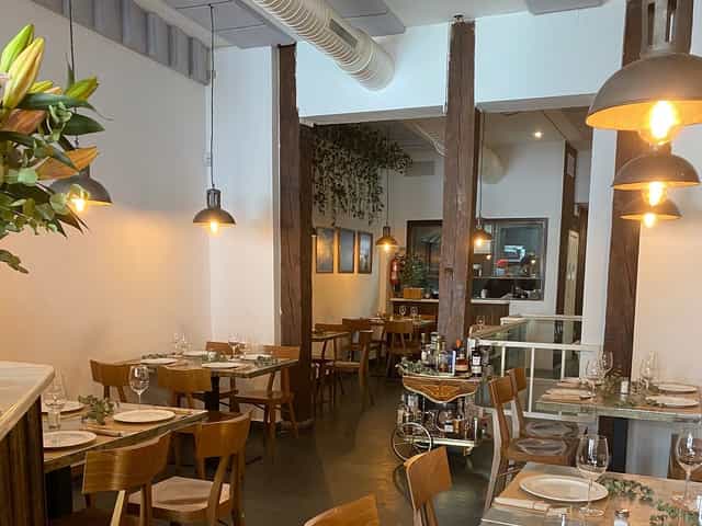 Sép7ima Restaurant with warm lighting, ideal for a boutique corporate reception or networking dinner.