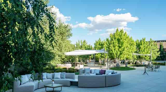 Luxury outdoor breakout area at UZalacaín La Finca with lounge seating for corporate networking.