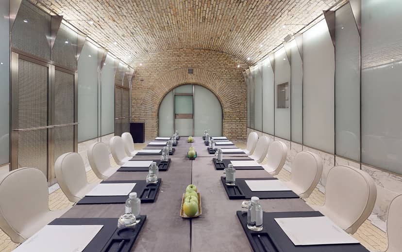 Boardroom meeting room with historic brick vault, Palazzo Naiadi Rome event venue.