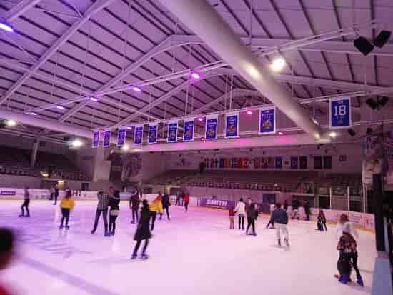 Purple uplighting at Planet Ice rink for corporate team building event.