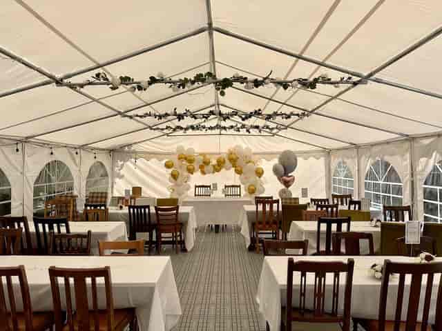 Serendipity venue marquee with white drapery for wedding and party event rentals.