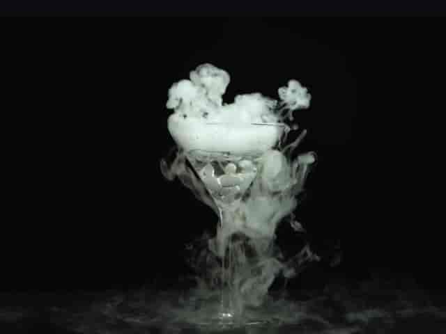 Dry-ice signature cocktail at DESIRE venue for luxury corporate event receptions.