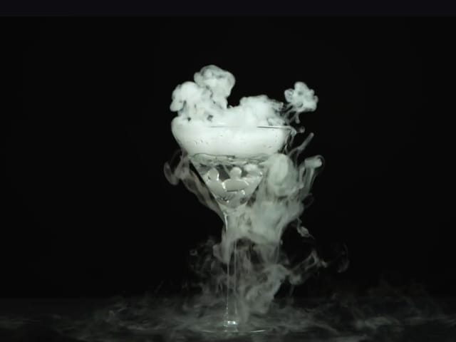 Dry-ice signature cocktail at DESIRE venue for luxury corporate event receptions.