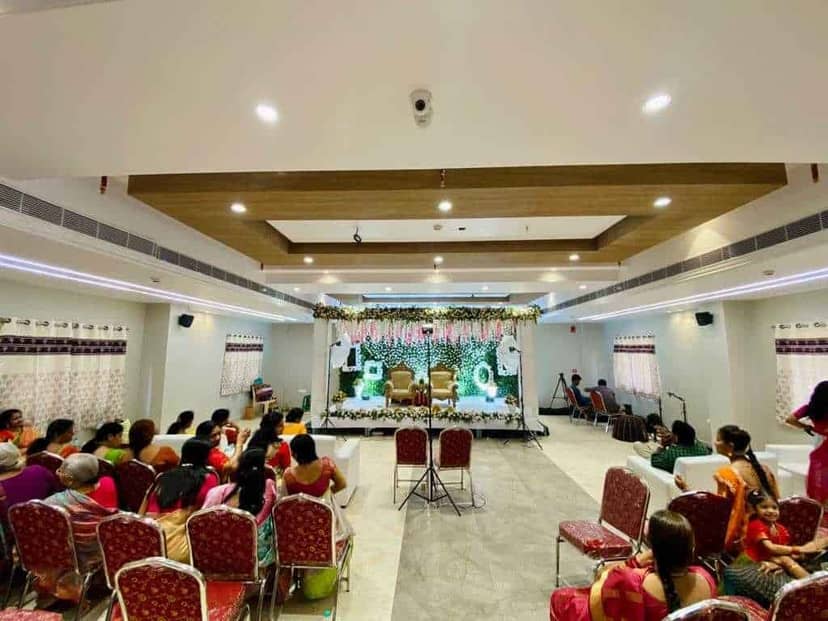 Grand Milan Lambrate banquet hall with stage, set for wedding ceremony and event seating.