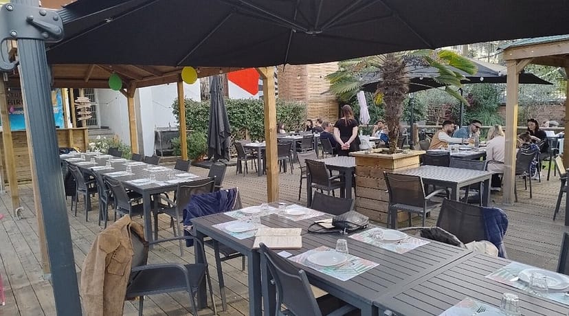 Casual outdoor dining setup with modular square tables for informal group events at Spazio Cairoli.