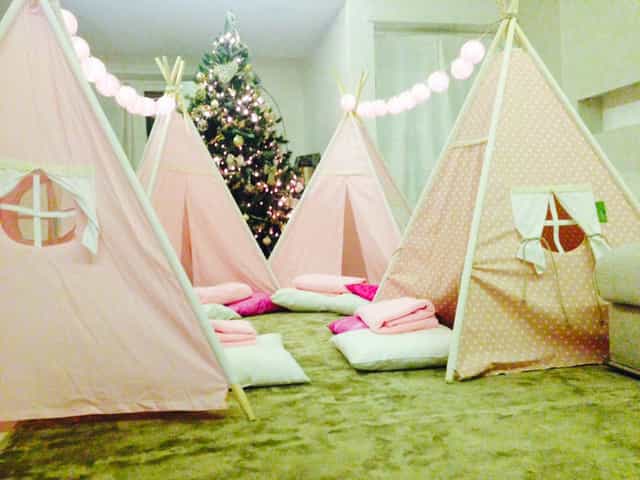 Glamping-themed baby shower setup with festive lighting, perfect for VIP micro-events.