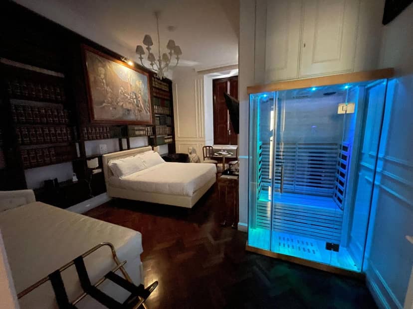 Eclectic Hotel Navona luxury suite with private sauna for wellness corporate retreats.