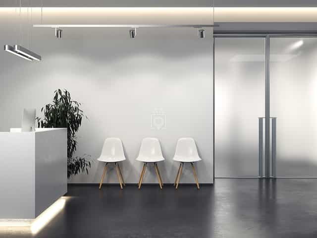 Minimalist registration area at Spaces Turati for professional brand activations and events.