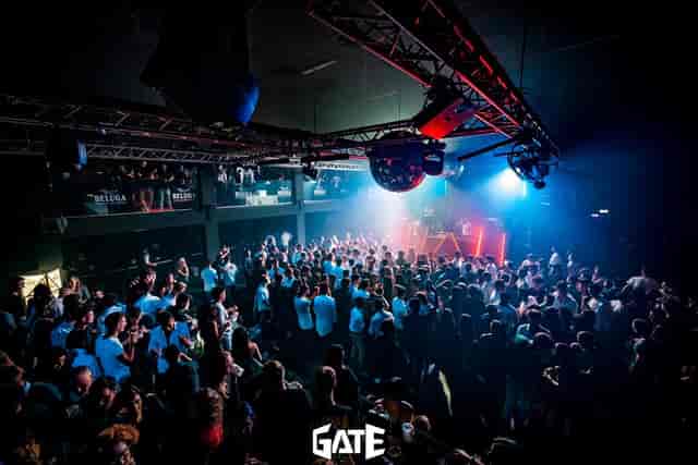 Gate Milano dance club: industrial reception space with DJ booth for corporate events or parties.