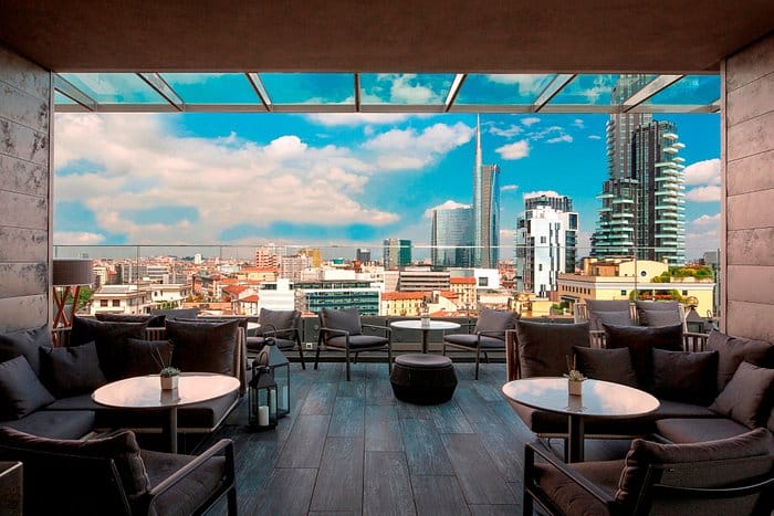 Rooftop terrace at ME Milan Il Duca with cityscape views for luxury corporate networking events.