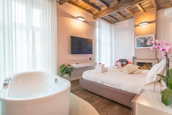 Luxury boutique hotel suite with rustic architectural details for executive travel.