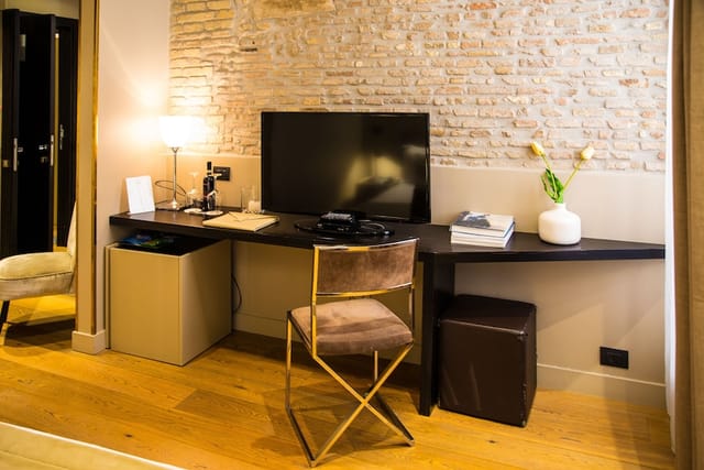 Boutique hotel workspace in Campo Marzio, minimalist desk, luxury business travel accommodation.
