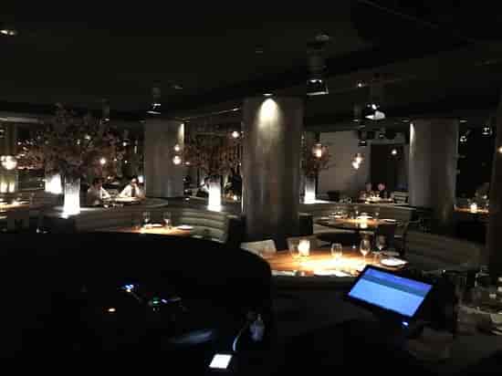 STK Milan restaurant with curved banquettes for corporate dinners and evening receptions.