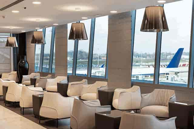 Modern airport lounge with premium seating for professional networking events and conferences.