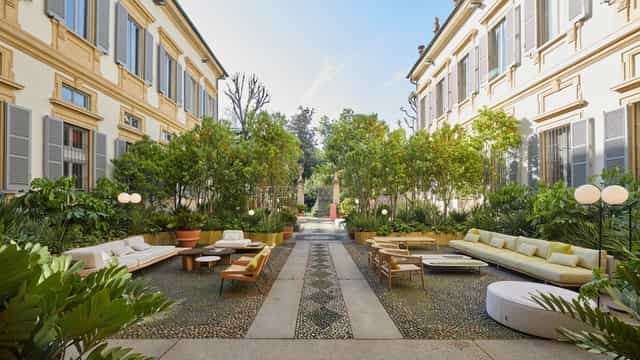 Luxury outdoor courtyard lounge at Palazzo Bovara for corporate events and networking mixers.