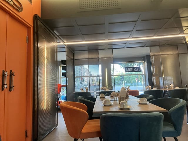 Modern Admiral Hotel executive meeting room with lounge seating for small business brainstorming.