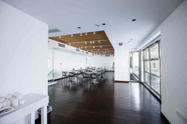 Ambrosia Hall at Magna Pars: Modern banquet space with timber ceilings for corporate events.