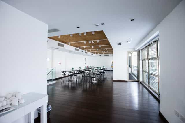 Ambrosia Hall at Magna Pars: Modern banquet space with timber ceilings for corporate events.
