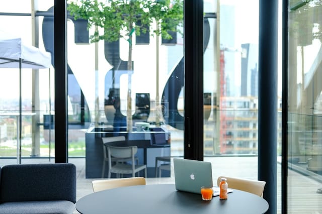 Copernico Isola breakout space with urban view, ideal for networking and remote work events.