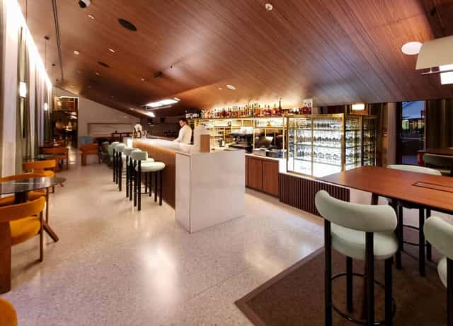 Isola Ristorante lounge: wood-paneled upscale space for networking events and corporate cocktails.