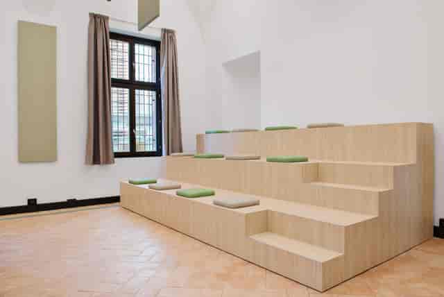 Milano Room: Modern tiered breakout space for professional workshops and presentations.