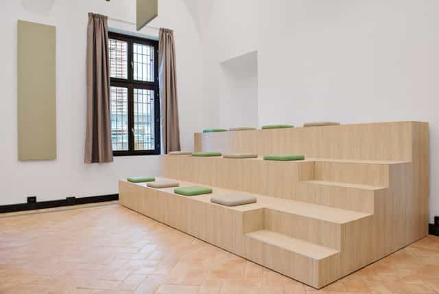 Milano Room: Modern tiered breakout space for professional workshops and presentations.